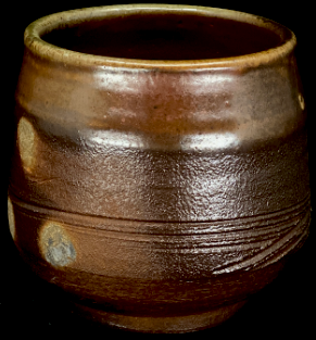 a woodfired cup with visible wadding marks